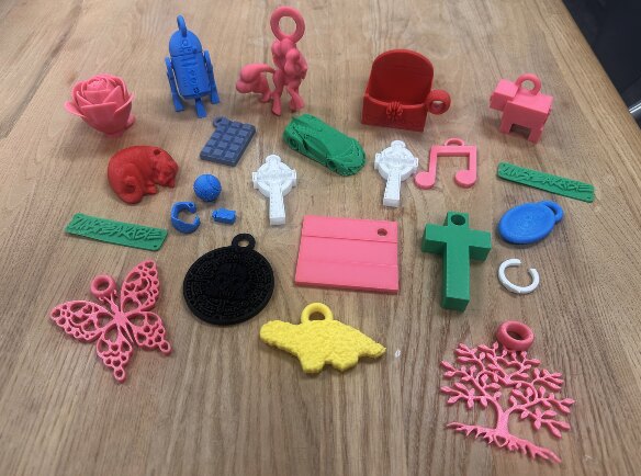 Colorful 3D-printed tactile objects and identifiers arranged on a table